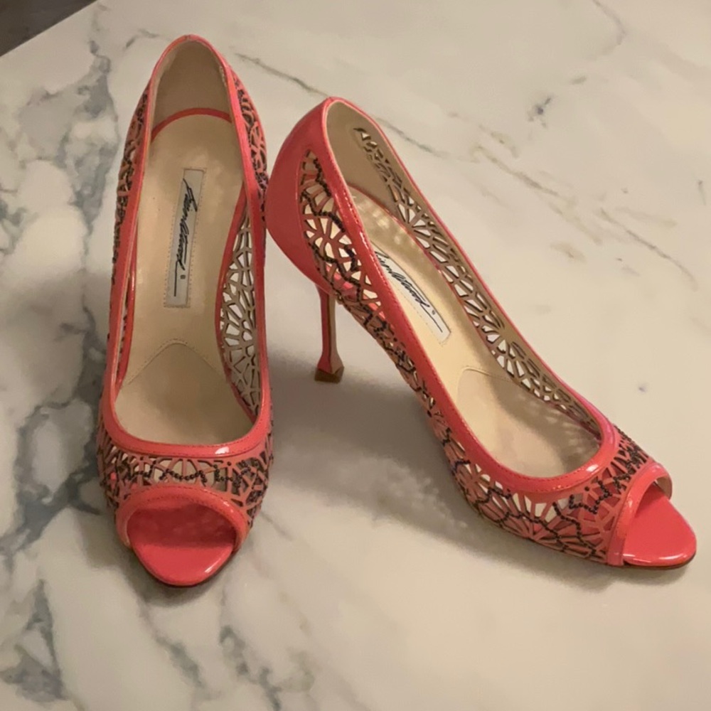 Salmon coloured evening dress shoe
Intricate leathered design with sm iron stud
